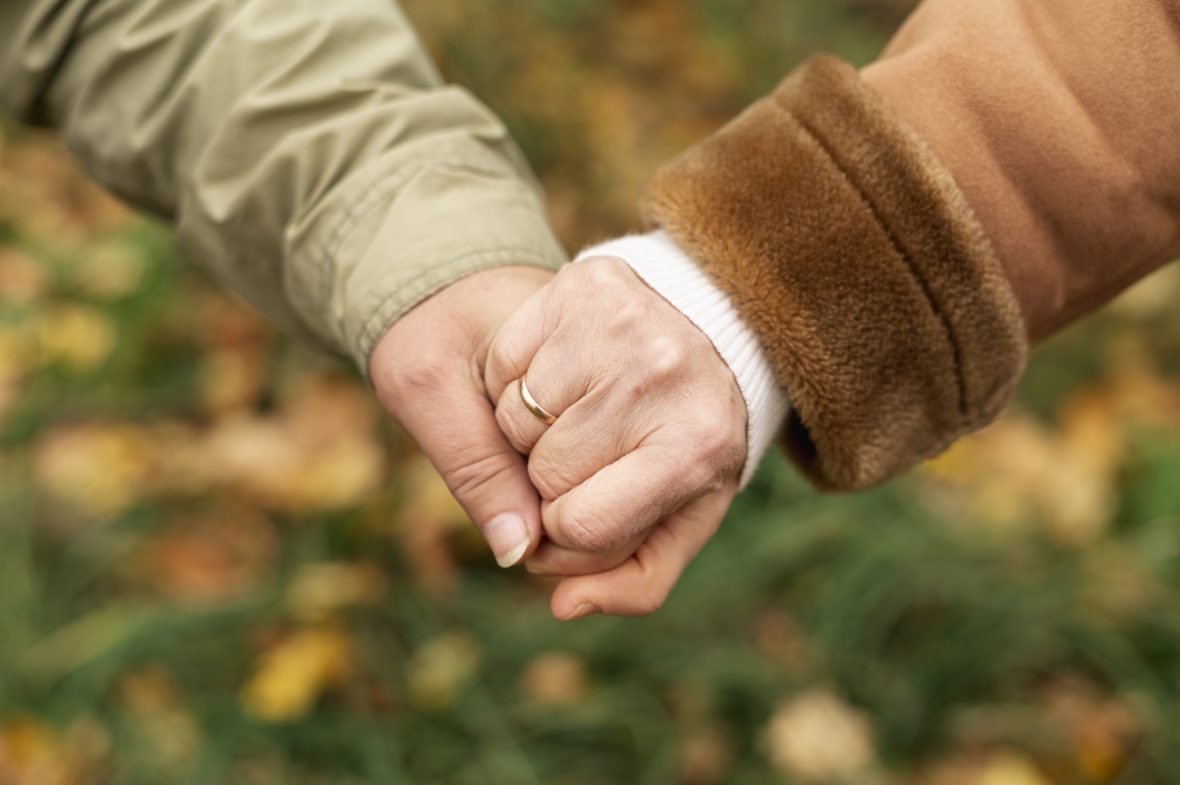 High angle senior couple holding hands